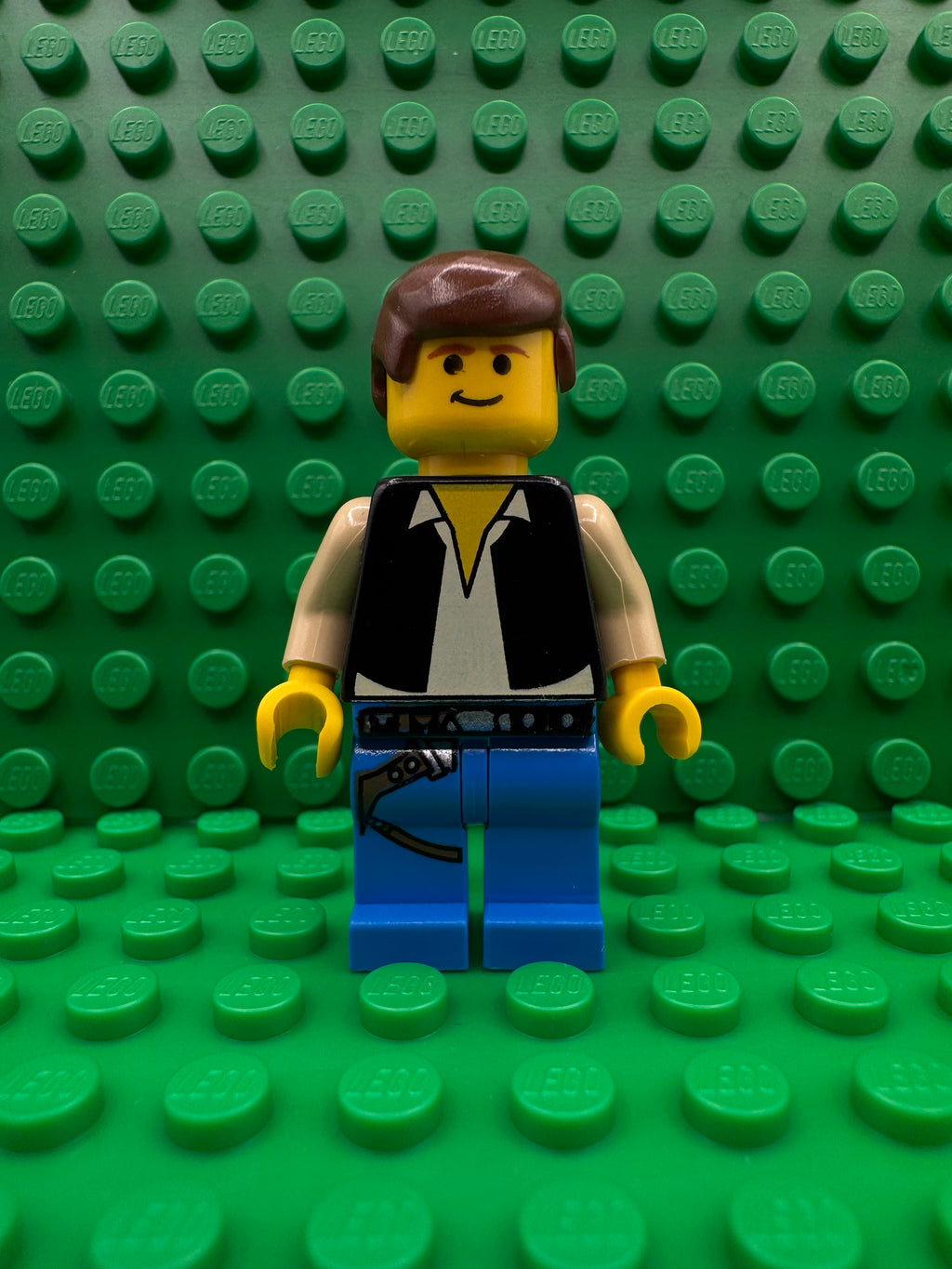 sw0014 Han Solo - Yellow Head, Black Vest over Tan Shirt, Blue Legs with Belts