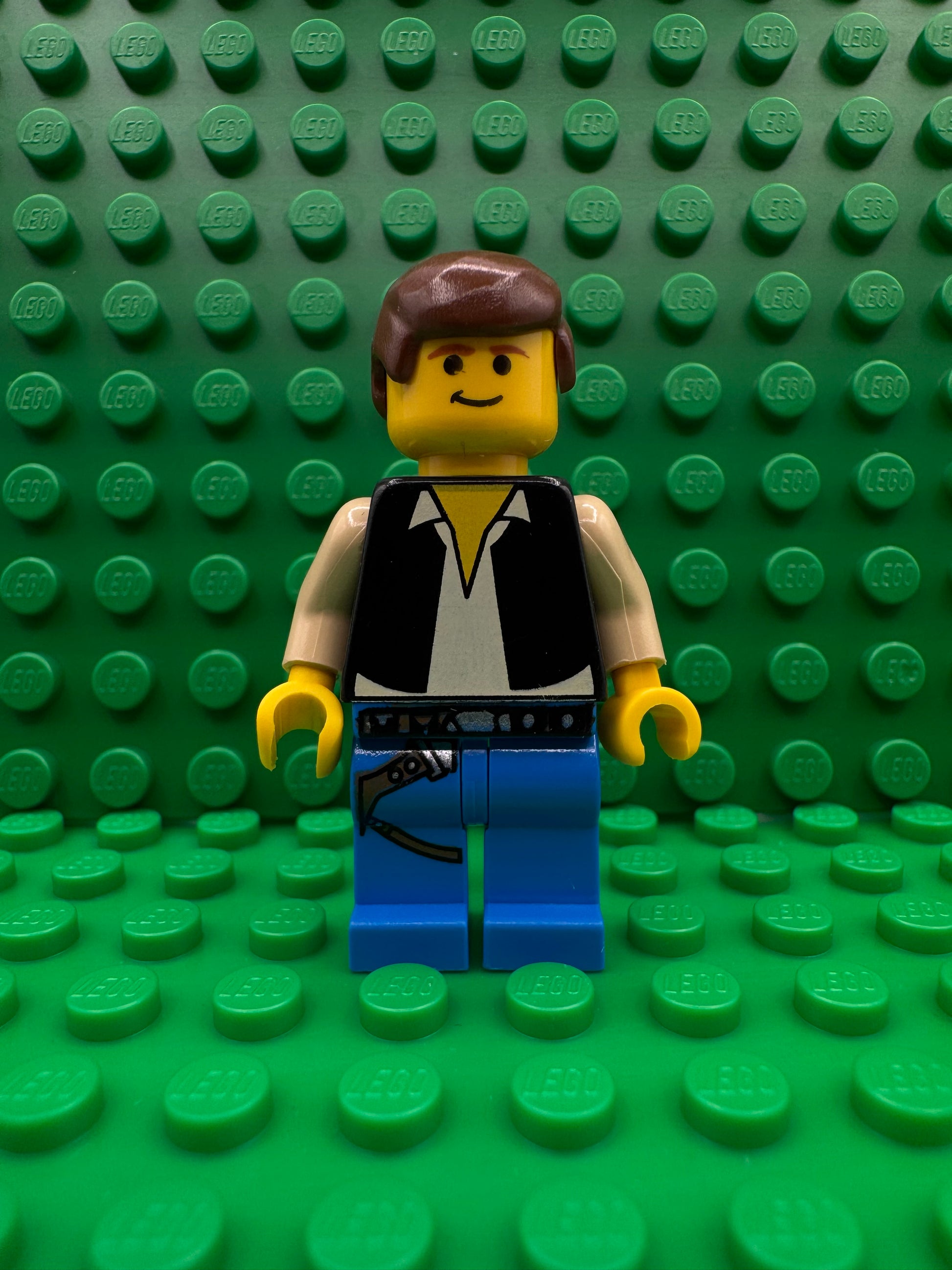 sw0014 Han Solo - Yellow Head, Black Vest over Tan Shirt, Blue Legs with Belts